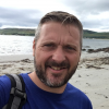 Picture of Billy Wardrop with a beach behind him