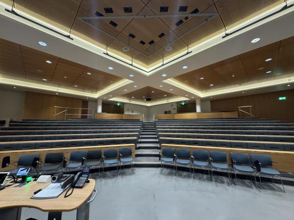 Photo of tiered seating in the lecture theatre, taken from the stage.